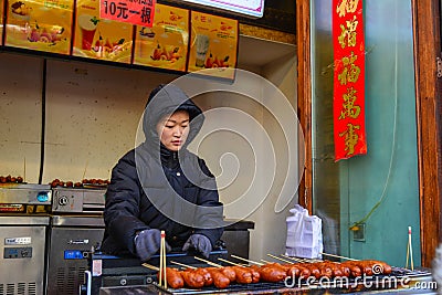 A vendor selling food on walking street Editorial Stock Photo