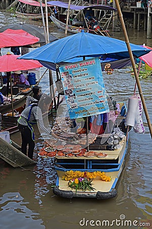 Vendor selling grilled fresh seafood in a floating market in Bangkok Thailand Editorial Stock Photo