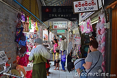 Vendor and shops selling along the outdoor corridor of Bogyoke Market Editorial Stock Photo