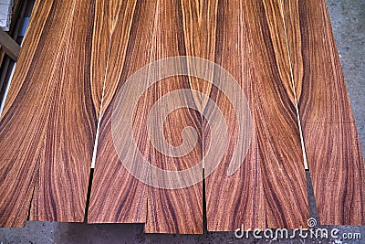 Veneer Santos Rosewood. Wood texture. Woodworking and carpentry production Stock Photo