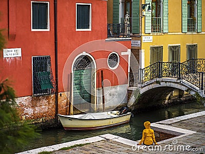 Venetian architecture details with a person sitting Editorial Stock Photo