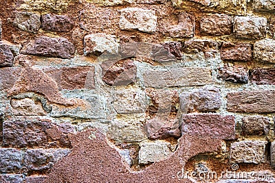 Venetian building weathered wall surface brick wall detail. Stock Photo
