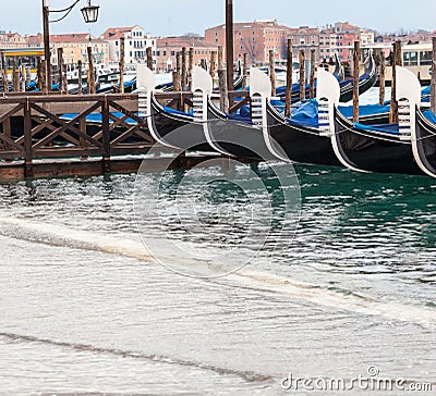 Venetian gondolas with high tide. Editorial Stock Photo