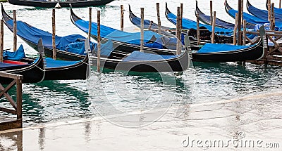 Venetian gondolas with high tide. Stock Photo