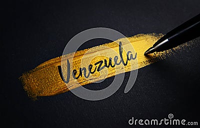 Venezuela Handwriting Text on Golden Paint Brush Stroke Stock Photo