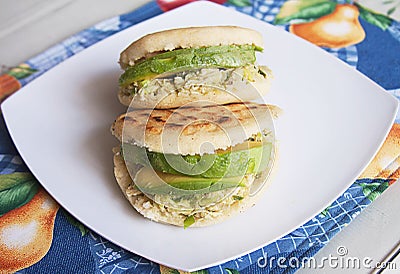 Venezuelan Arepas Homemade Venezuelan Arepas Close up. Reina Pepiada. Avocado and Chicken Arepa. Stock Photo