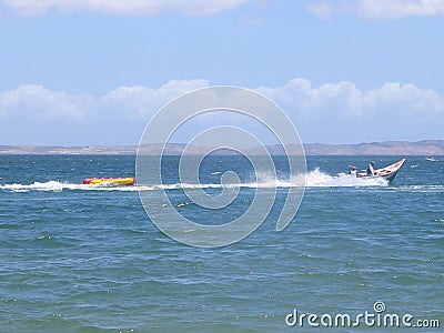 Venezuelan typical boat with inflatable banana Editorial Stock Photo