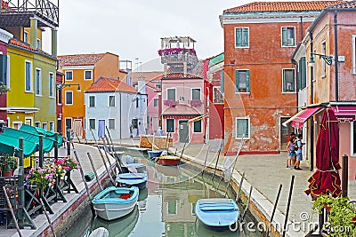 Venice, Burano island canal, small colored houses and the boats Editorial Stock Photo