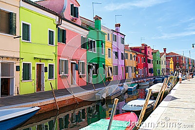 Venice, Burano island canal, small colored houses and the boats Editorial Stock Photo