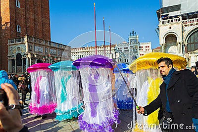 Spectacular Venice Masquerade celebration costumes and crowd of tourists Italy Editorial Stock Photo