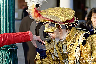 Venice Carnival Participant and Reveller. Prince Charming Kissing hand Editorial Stock Photo