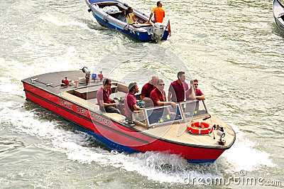 Venice city with firemen in a boat , Italy Editorial Stock Photo