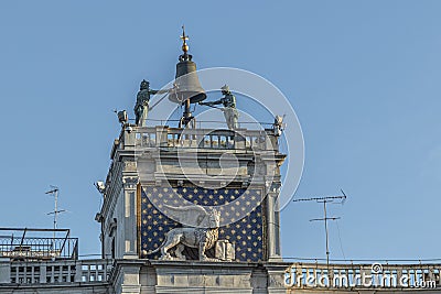 Venice, Clock and bell tower in Renaissance style in San Marco square with the statues called Mori di Venezia, UNESCO world Stock Photo