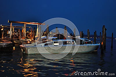 venice in the evening, the romantic city is enriched with lights that make another image, a walk is a must. Editorial Stock Photo