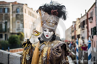 Venice - February 6, 2016: Colourful carnival mask through the streets of Venice Editorial Stock Photo