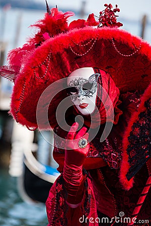 VENICE, FEBRUARY 10: An unidentified woman in typical dress poses during Venice Carnival Editorial Stock Photo
