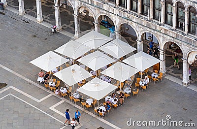 Aerial view with a outdoor restaurant cafe in St Marks Square in Venice Editorial Stock Photo