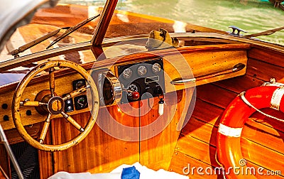 VENICE, ITALY - AUGUST 19, 2016: High-speed passenger retro style boat on the Venetian channels on August 19, 2016 in Venice Editorial Stock Photo