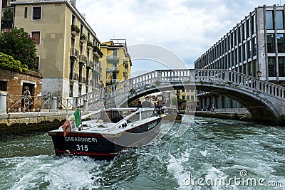Water gendarmerie on a boat patrols canals of the city of Venice Editorial Stock Photo