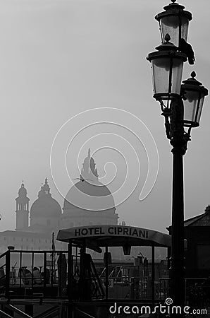 Venice, Italy, December 28, 2018 Basilica in the background with typical Venetian street lamp in the foreground Editorial Stock Photo