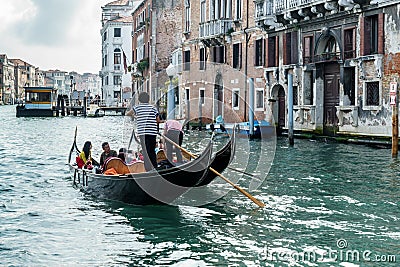 VENICE, ITALY/EUROPE - OCTOBER 12 : Gondolier ferrying people in Editorial Stock Photo