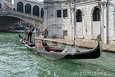 VENICE, ITALY/EUROPE - OCTOBER 12 : Gondolier ferrying people in Editorial Stock Photo