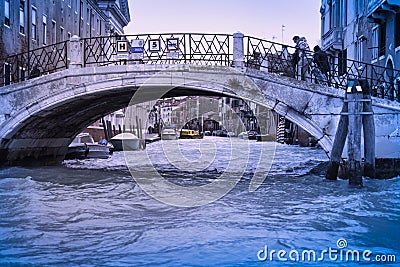 A bridge and the entrance to a small canal venice Editorial Stock Photo