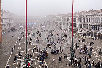 Venice Italy elevated day view of tourists on Saint Mark main square, around famous cafe bistro outdoor Editorial Stock Photo