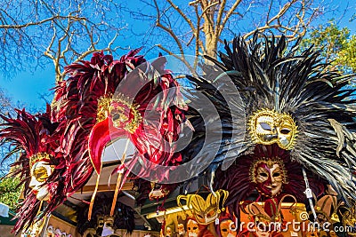 Spectacular Venetian carnival masks displayed for sale on vendor stand Italy Editorial Stock Photo