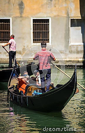 VENICE, ITALY - JULY 12 : Gondolier in Venice Italy Editorial Stock Photo