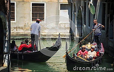 VENICE, ITALY - JULY 12 : Gondolier in Venice Italy Editorial Stock Photo