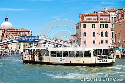 Vaporetto sails below the Ponte degli Scalzi on the Grand Canal in Venice Editorial Stock Photo