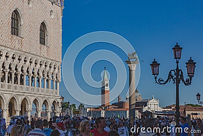 Tourists on San Marco square with views of Church of San Giorgio Maggiore Editorial Stock Photo