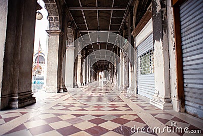 Venice. Arcades of Procuratie Vecchie in Venice on San Marco Square. Italy. Early Morning. Closed Editorial Stock Photo