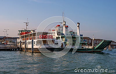 Venice, Italy - 08 May 2018: Ferry Pellestrina and Altino, at the pier in the lagoon of Venice. The ferry carries cars Editorial Stock Photo