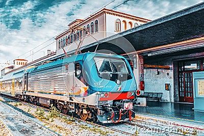VENICE, ITALY - MAY 13, 2017 : Modern high-speed passenger train stand on main railways station Venice - Venezia Santa Lucia on Editorial Stock Photo
