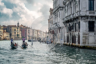 VENICE/ITALY - OCTOBER 12 : Gondoliers Ferrying People in Venice Editorial Stock Photo