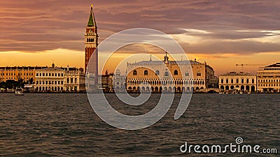 Venice, Italy - October 23, 2018, magnificent sunset over the Grand Canal against the background of the Campanile of St. Mark`s Editorial Stock Photo