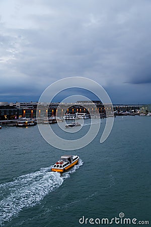 Venice, Italy - October, 6 2019: Vaporetti or Venetian public water buses, or water taxies in Venetian Lagoon at Cruise Editorial Stock Photo