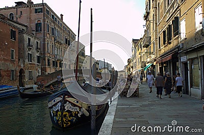 Venice, Italy: One of the many arch bridge linked to Jewish ghetto over the canal with motor boats and Editorial Stock Photo