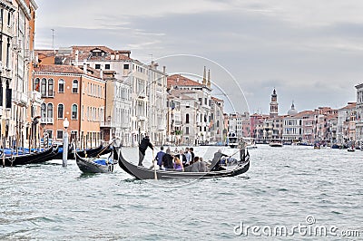 Venetians going to work in a gondola in Venice Editorial Stock Photo
