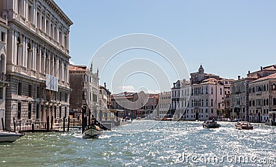 Water channels of Venice city. Facades of residential buildings overlooking the Grand Canal in Venice, Italy. Editorial Stock Photo