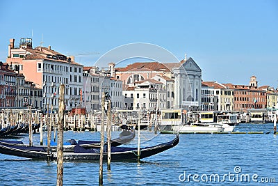 Venice landscape with moored gondolas and St. Mary of the Visitation Church Stock Photo