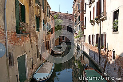 Venice panorama: canal, boats and old brick houses in Venice, Italy, Europe Stock Photo