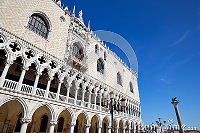 Venice, white Doge palace facade and San Marco lion statue, Italy Stock Photo