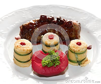 Venison with quince in cherry broths Stock Photo