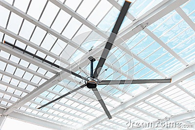 Ventilation Electrical Ceiling Fan Indoor Hall of Building, Luxury Modern Architecture Roofing Transparent Grass and Structure Stock Photo