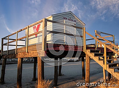 Ventnor City, New Jersey - December, 2020: Lifeguard supply shack on wood pile stilts on the beach at New Haven Editorial Stock Photo