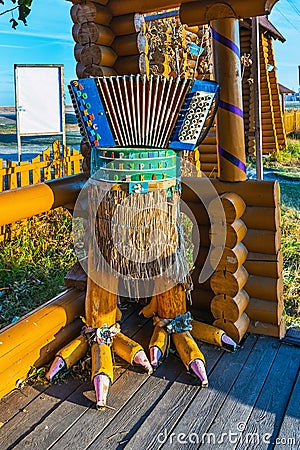 Accordion on chicken legs. Novy Sharap Village, Western Siberia Editorial Stock Photo