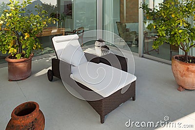 Veranda with chaise longue Stock Photo